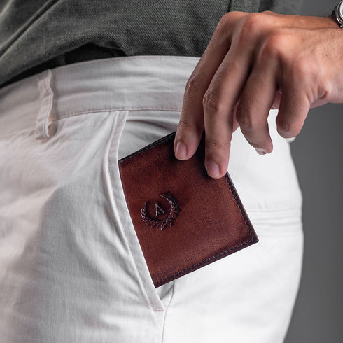 Blanc - A sleek, minimalist bi-fold wallet with an integrated flip ID section, Blanc is thoughtfully designed to maximise utility while maintaining an exceptionally slim profile. A model is showcasing this by putting in the side pocket of his pants