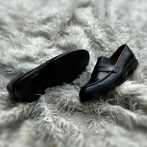 Alonso - Single component Penny loafer meticulously hand-crafted from the highest tier Black Calf leather. Featuring double soles - a leather mid sole and outer Vibram sole protector