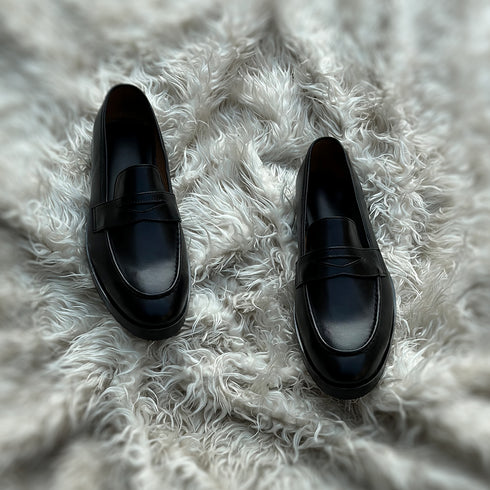 Alonso - Single component Penny loafer meticulously hand-crafted from the highest tier Black Calf leather. Featuring double soles - a leather mid sole and outer Vibram sole protector