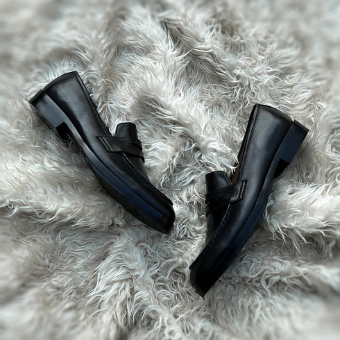 Alonso - Single component Penny loafer meticulously hand-crafted from the highest tier Black Calf leather. Featuring double soles - a leather mid sole and outer Vibram sole protector