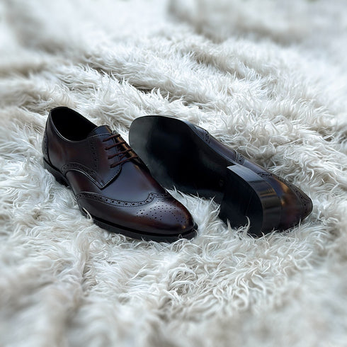 Burnam - Wing-tip derby with toe medallion and brogue detailing. Finished in the beautiful Umber patina