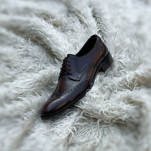 Burnam - Wing-tip derby with toe medallion and brogue detailing. Finished in the beautiful Umber patina