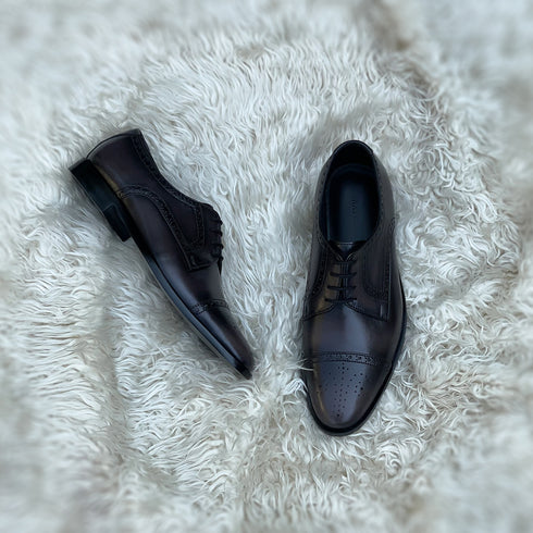 Edwin - Cap toe Derby with a beautiful medallion and brogue detailing. Finished in the unique Ashen Carob Patina