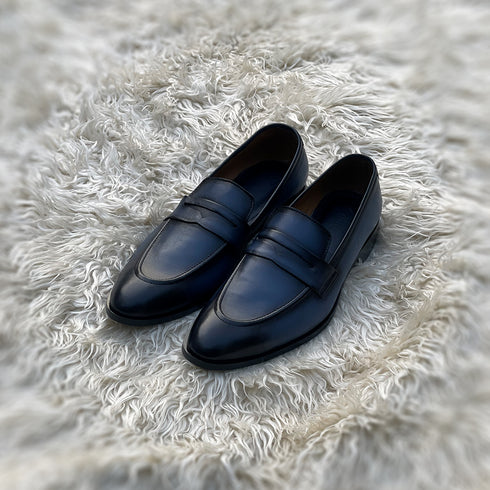 Jacob - A single component dress penny loafer made from the finest nappa leather. Finished in the very beautiful ocean mist blue patina