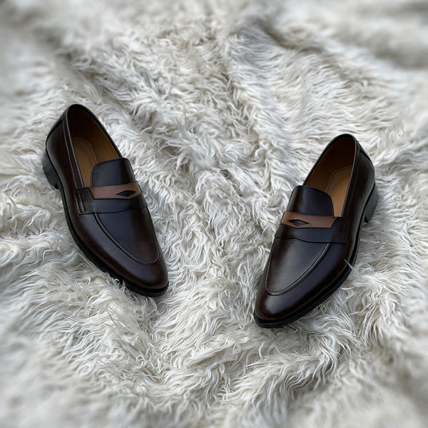 Millar 2.0 - Penny loafer made from the finest tannery dyed dark brown Calf leather along with contrasting yet complimentary leather tie detailing.