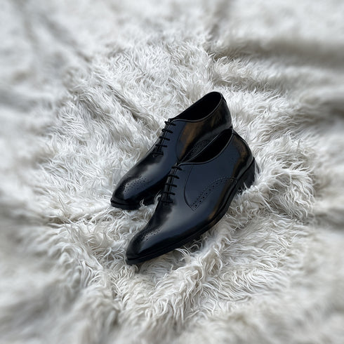 Oscar 2.0 - Two component Dress Oxford with an elegant toe & back counter medallion. Meticulously hand-crafted from the finest black calf leather.