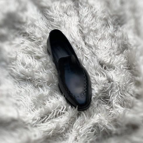 Simon - Wholecut slip-on with hand stitch detailing on the apron. Made from the finest black Calf leather, soft inner crust calf leather lining and welted vegetable tanned leather sole.