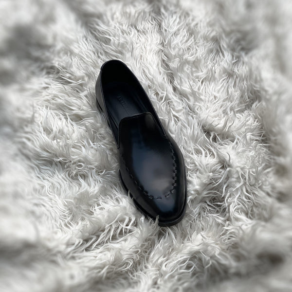 Simon - Wholecut slip-on with hand stitch detailing on the apron. Made from the finest black Calf leather, soft inner crust calf leather lining and welted vegetable tanned leather sole.