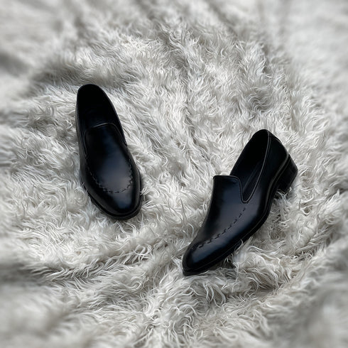 Simon - Wholecut slip-on with hand stitch detailing on the apron. Made from the finest black Calf leather, soft inner crust calf leather lining and welted vegetable tanned leather sole.