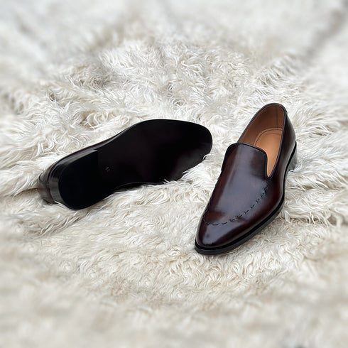 Simon - Wholecut slip-on with hand stitch detailing on the apron. Made from the finest Calf leather, soft inner crust calf leather lining and welted vegetable tanned leather sole. Finished in the beautiful gradient maple patina