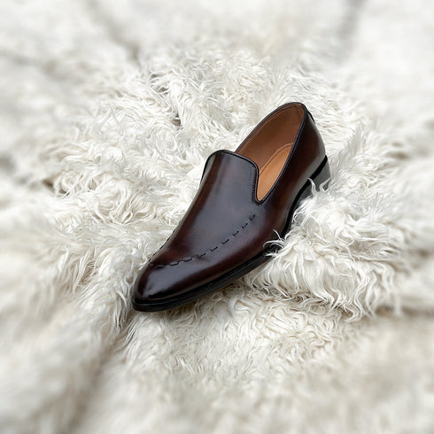 Simon - Wholecut slip-on with hand stitch detailing on the apron. Made from the finest Calf leather, soft inner crust calf leather lining and welted vegetable tanned leather sole. Finished in the beautiful gradient maple patina