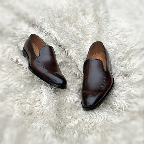 Simon - Wholecut slip-on with hand stitch detailing on the apron. Made from the finest Calf leather, soft inner crust calf leather lining and welted vegetable tanned leather sole. Finished in the beautiful gradient maple patina