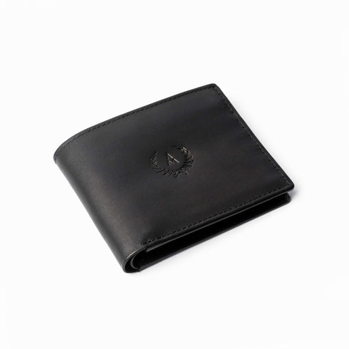 Milton - Leather wallet with flip ID slot. Made from soft black calf leather. Closed diagonally placed jacket view